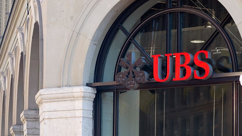 "Bern, Switzerland - June 26, 2011: The UBS logo in a window of the branch near the central train station in Bern, Switzerland. UBS is a globally active financial services company offering investment banking, asset management, and wealth management worldwide."